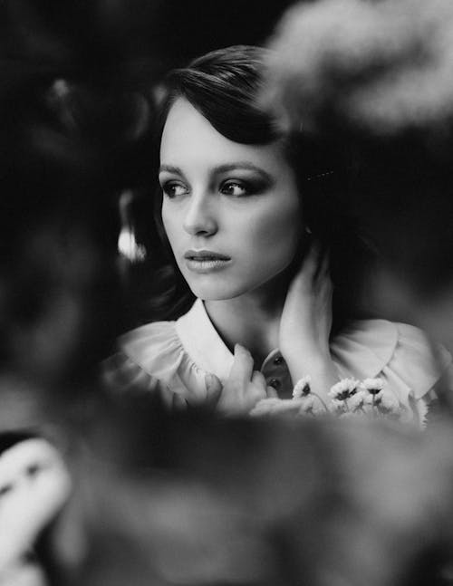 Dreamy black haired woman in garden