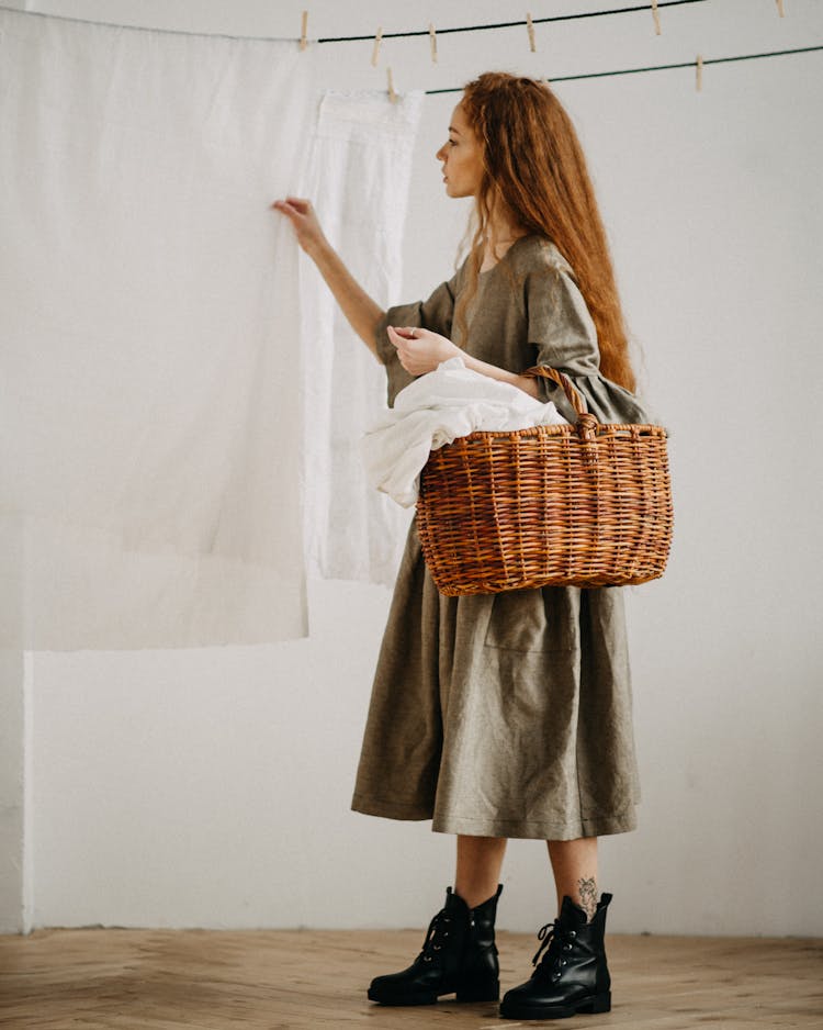 Woman Carrying A Laundry Basket