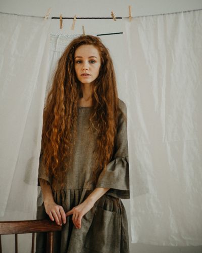 Woman in a rustic linen dress — photo by Dmitriy Ganin on Pexels