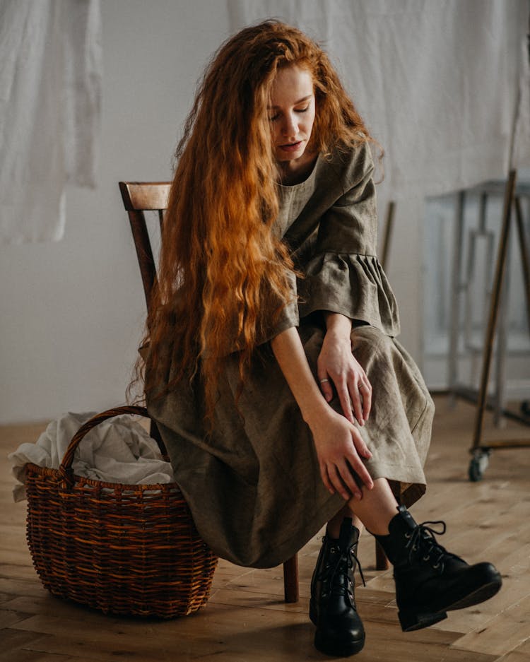 Tender Woman In Dress Sitting On Chair