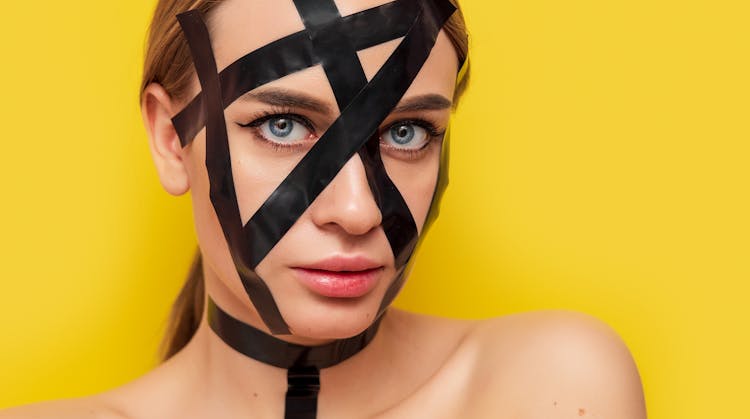 Woman With Black Tape On Face