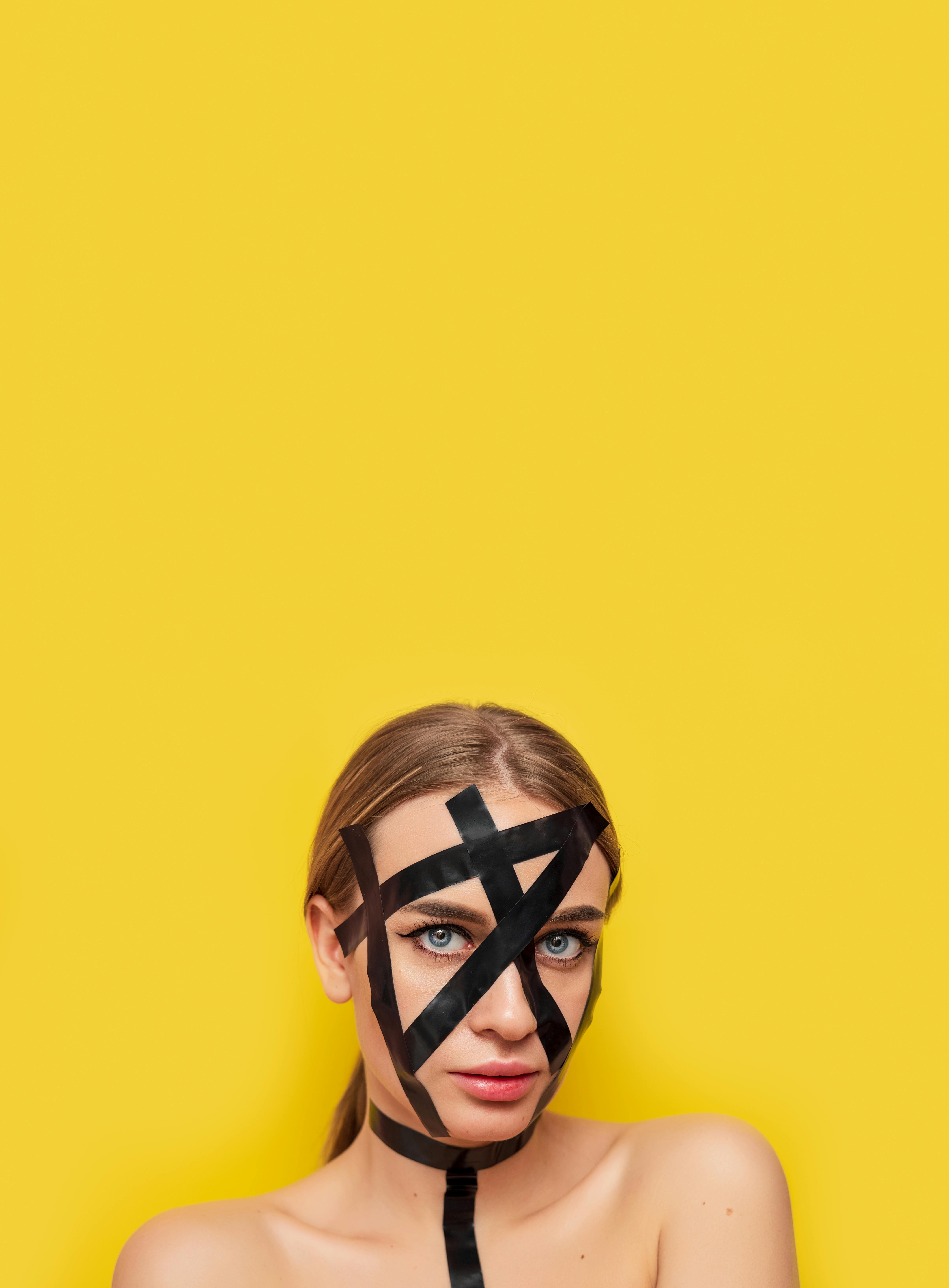 Abstract Photo of Woman With Black Masking Tape on Face · Free Stock Photo