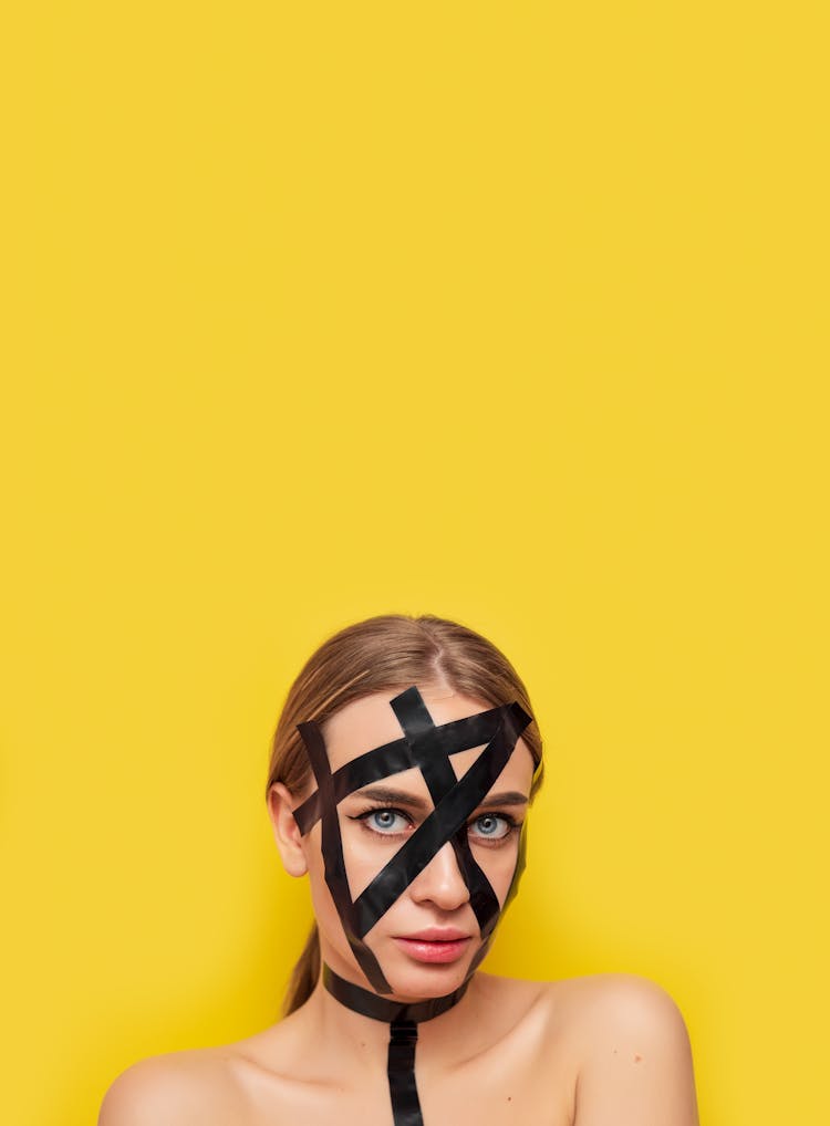Abstract Photo Of Woman With Black Masking Tape On Face