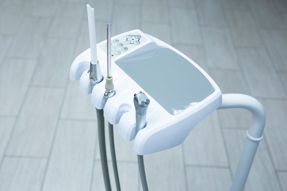 Close-up of high-tech dental tools in a clean, bright clinic.