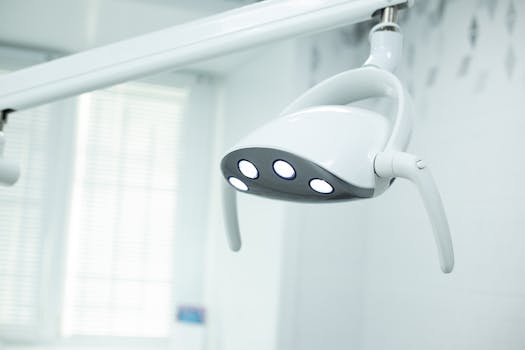 Close-up of modern dental exam light in a sterile clinical environment.