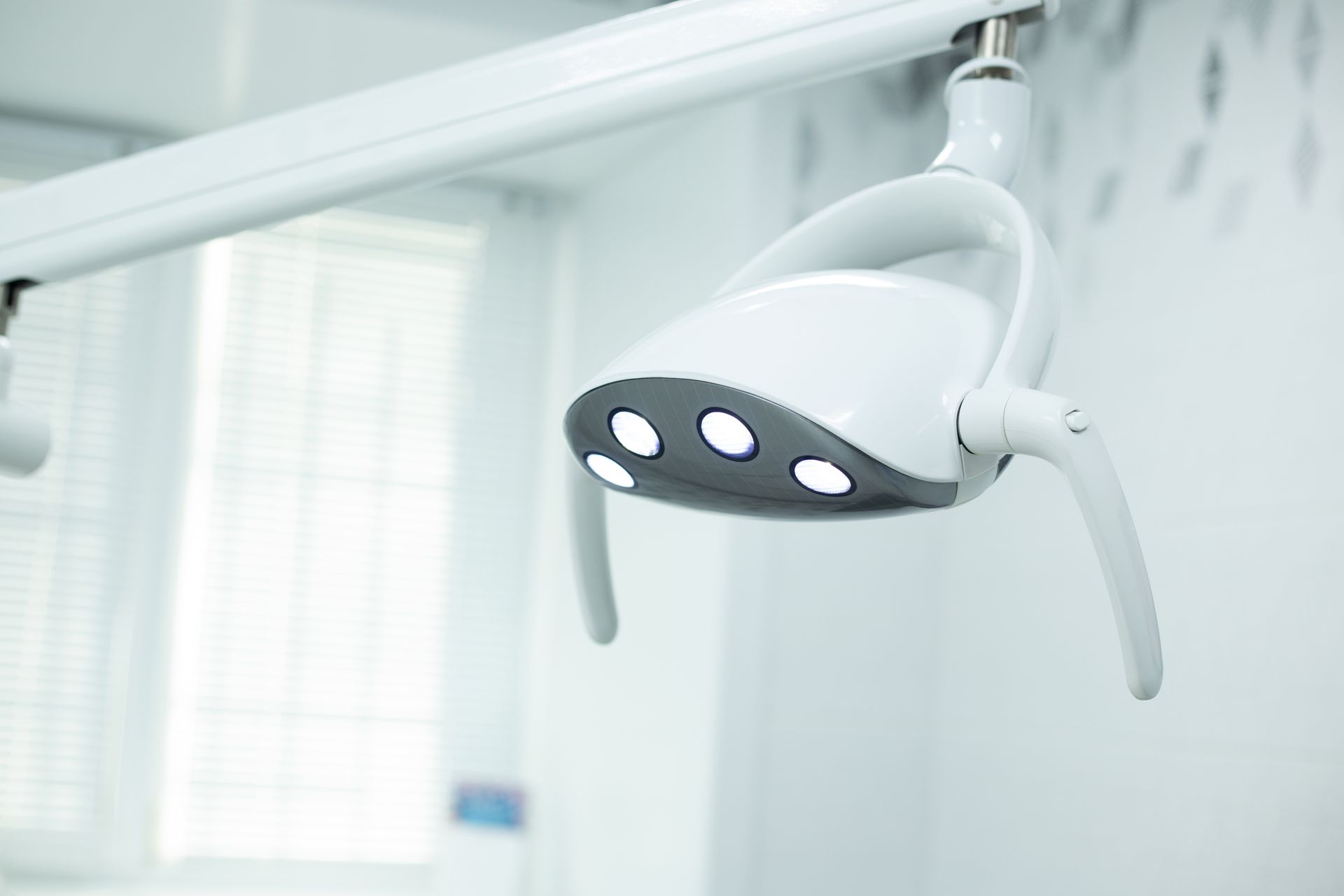 An empty clinic exam room in soft light.