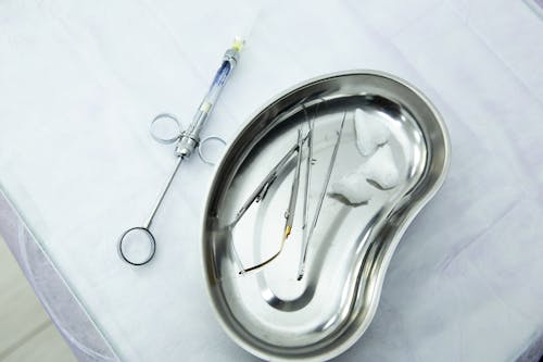 Medical Tools on a White Textile 