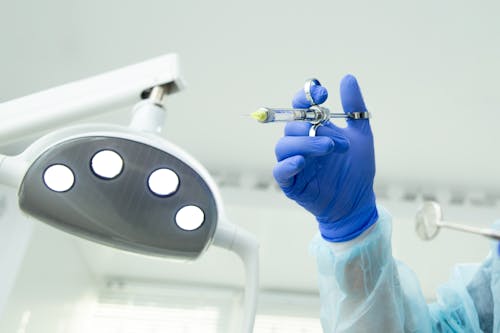 Medical Professional holding a Syringe 