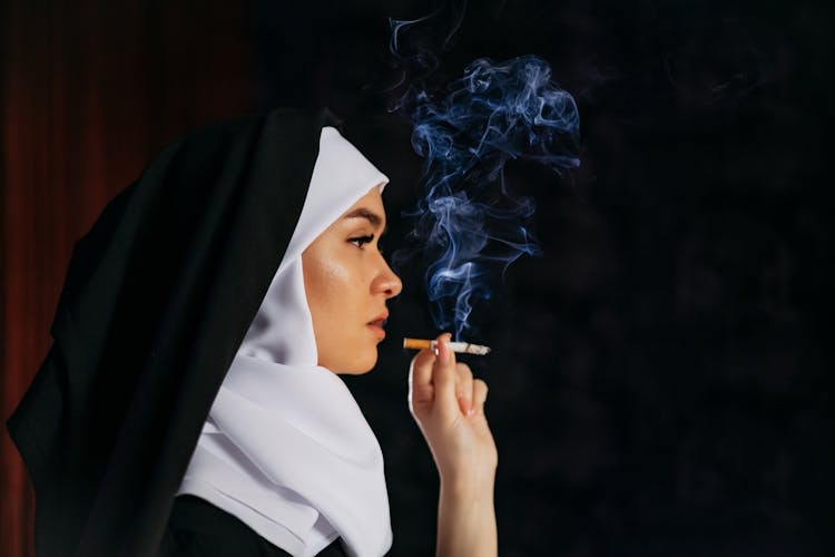 Photo Of A Smoking Nun