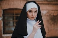 Woman in White Hijab and Black Long Sleeve Dress