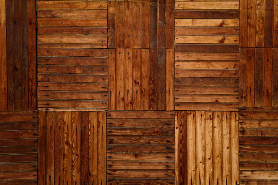 Close-up of a textured wooden parquet floor highlighting natural patterns and tones.