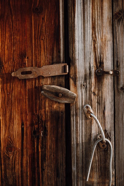Free Brown Wooden Door with Rusty Padlock  Stock Photo