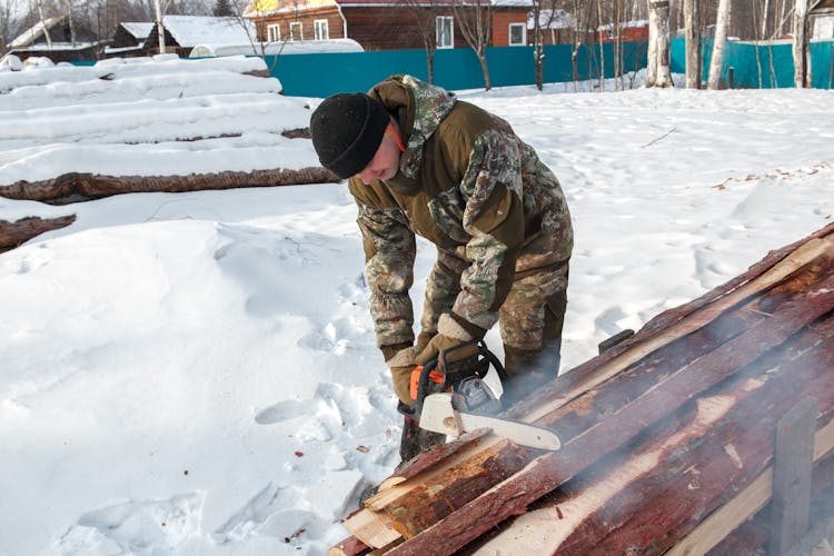 Man Using A Chainsaw