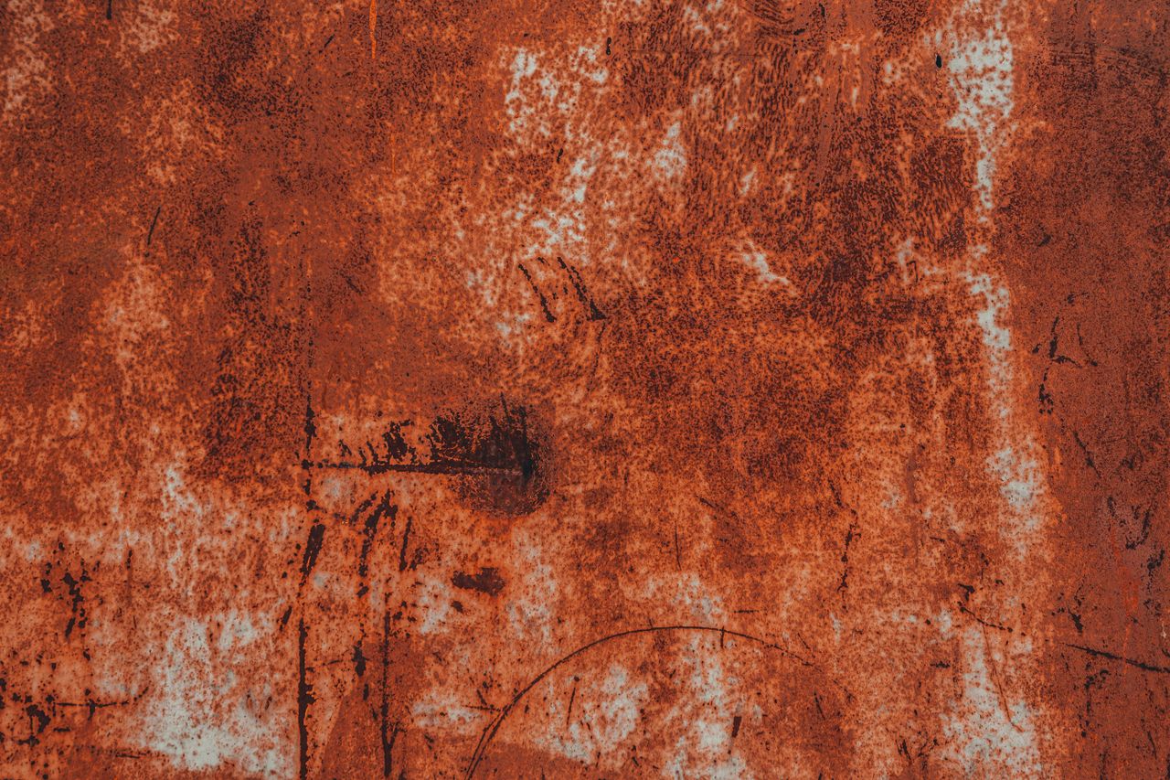 close up of a rusty metal surface showing detailed texture patterns an