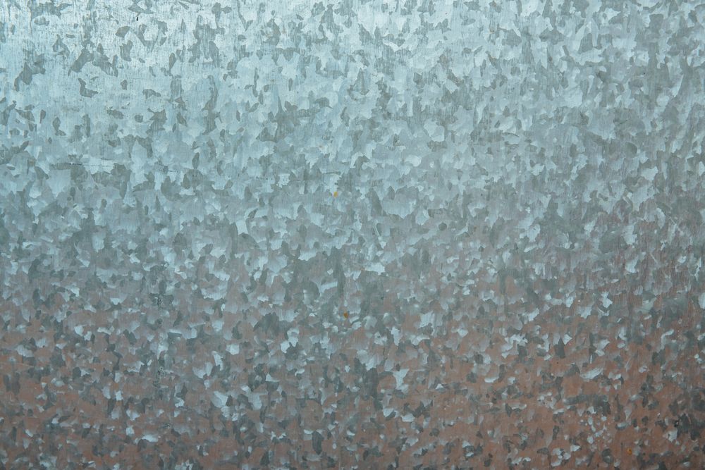 Close-up of a galvanized metal sheet surface and its natural metallic texture