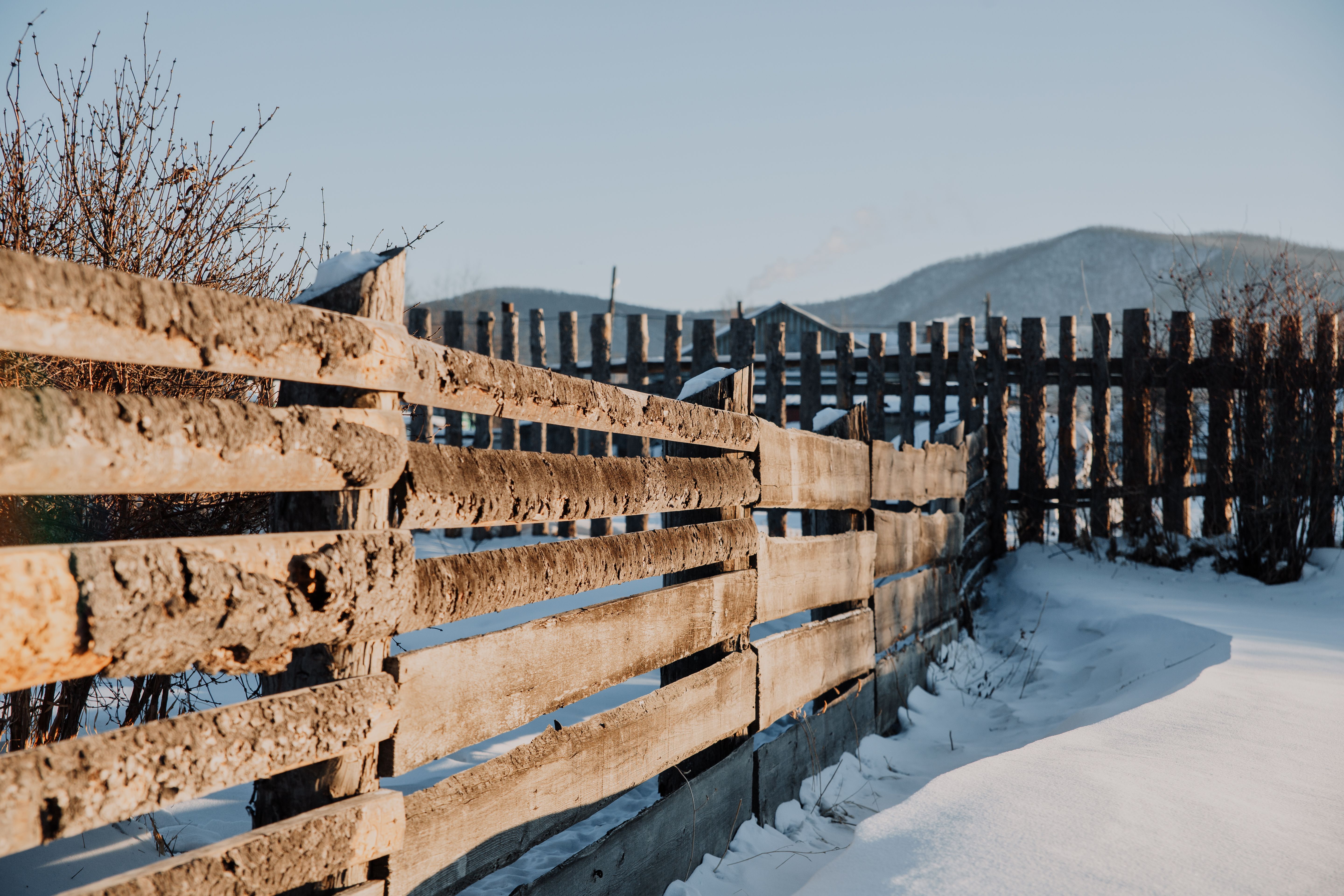 Brown Wooden Fence on Snow Covered Ground · Free Stock Photo