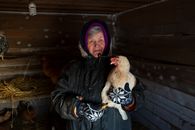 Woman in Black Leather Jacket Holding Brown Rabbit