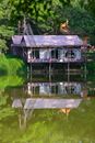 Purple Wooden House on River