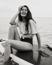 Woman on paddleboard board on water