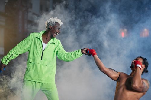 Free Two men perform martial arts with energy and intensity, surrounded by dramatic smoke. Stock Photo