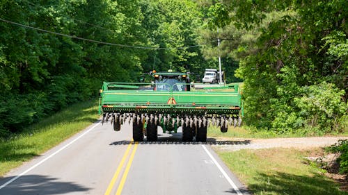 A Green Tractor on the Road