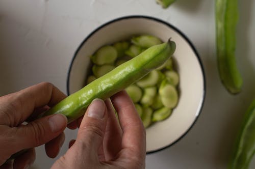 A Person Holding Broad Beans