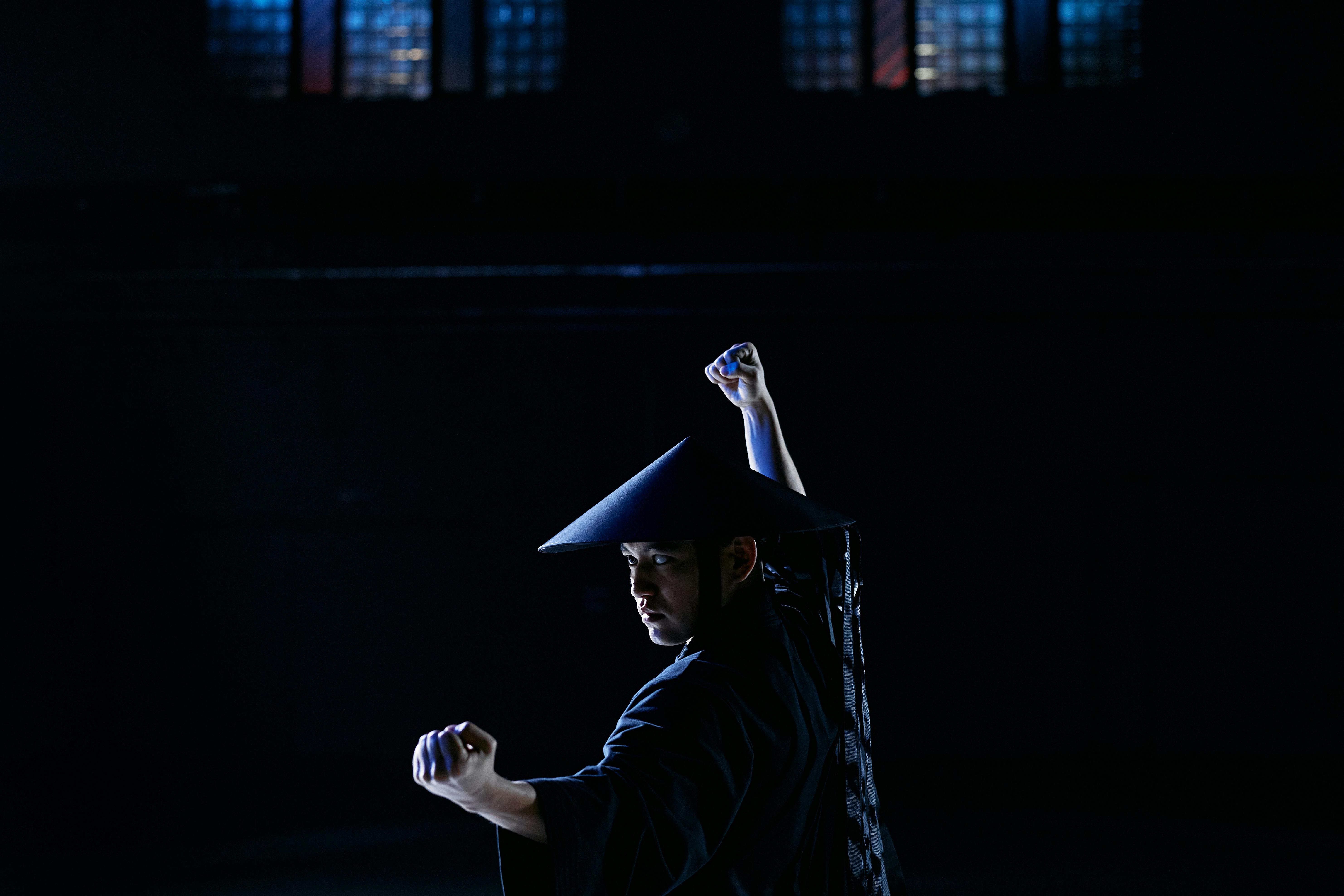 a man in black long sleeve robe