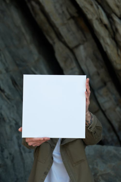 A Person Holding White Printer Paper