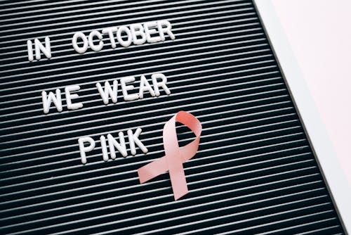 Free In October we Wear Pink Message on a Letterboard Stock Photo