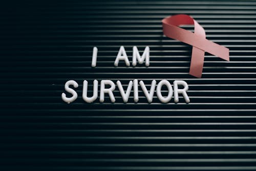Free I Am Survivor Note on a Letterboard Stock Photo