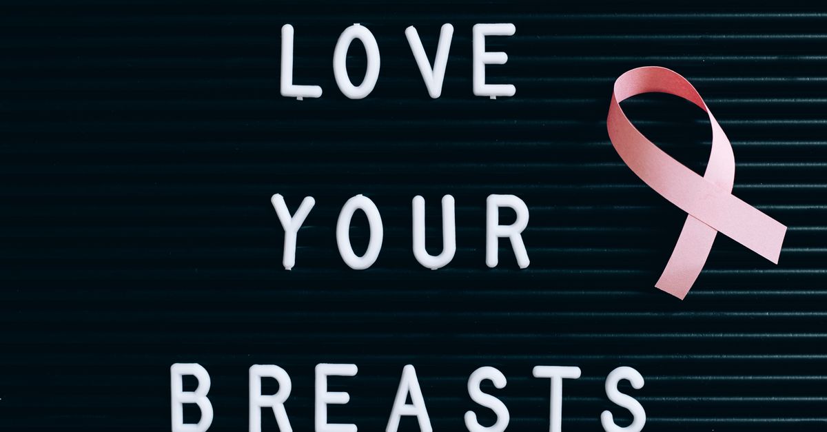 Pink Ribbon Post A Pink Ribbon on a Letter Board with Message · Free Stock Photo