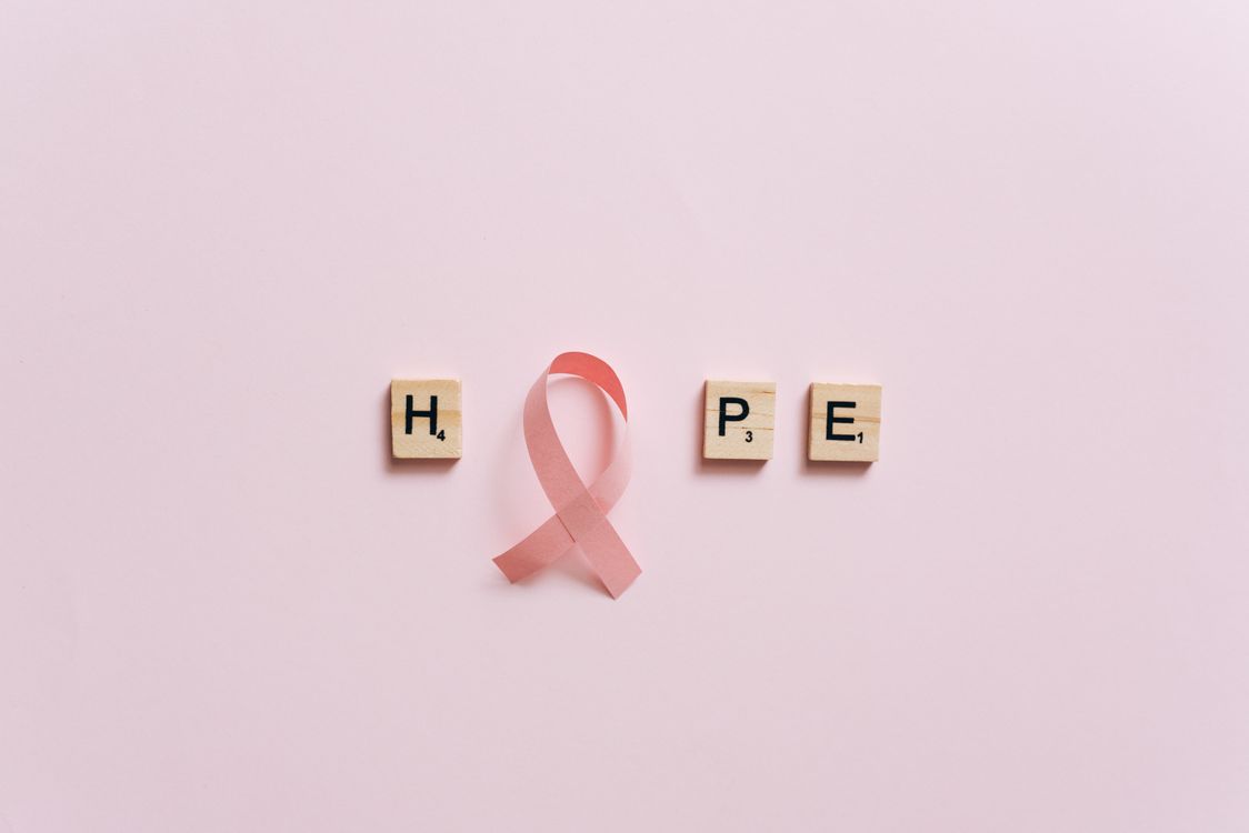 A Pink Ribbon on a Pink Surface with Message · Free Stock Photo