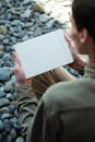 A Person Holding a Blank Paper