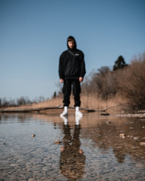 Blurred Shot of a Man Standing on a Wetland