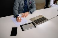 Man in Blue Suit Jacket Using Macbook Pro