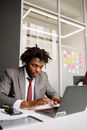 Man in Gray Suit Jacket Using Laptop Computer