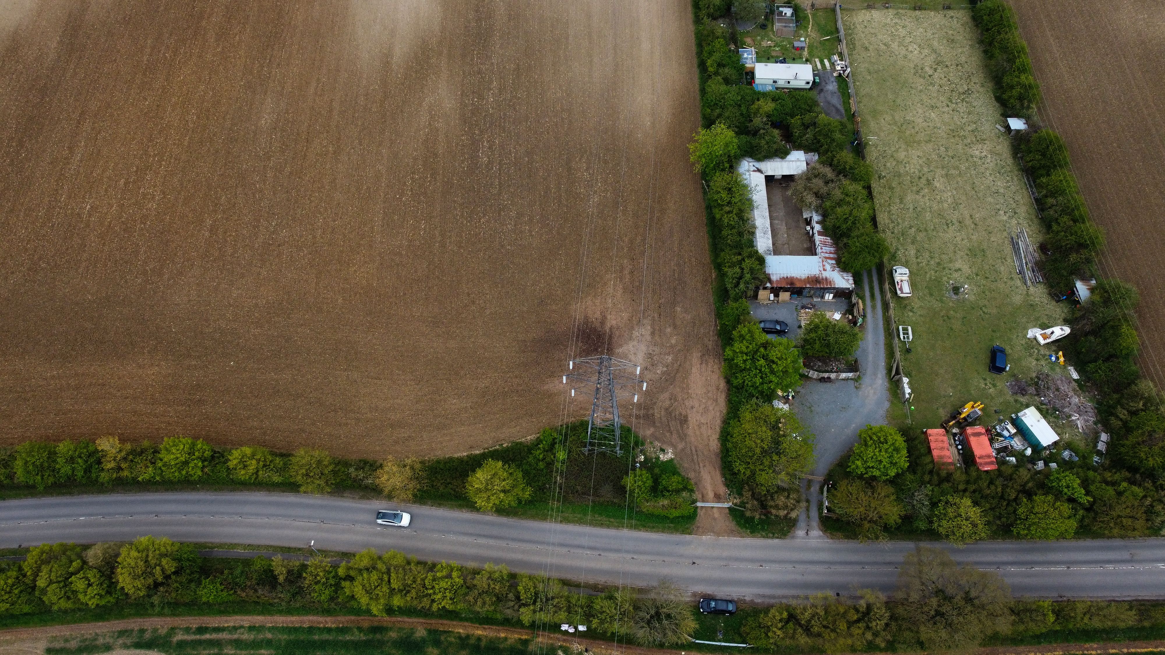 Outstanding 30 Minute Brighton and Newhaven Gyroplane Flight Review: An Open-Cockpit Adventure Over England's Stunning South Coast Review 2026 - Aerial view of verdant farmland with a road in Sundon, England, showcasing nature's expanse.