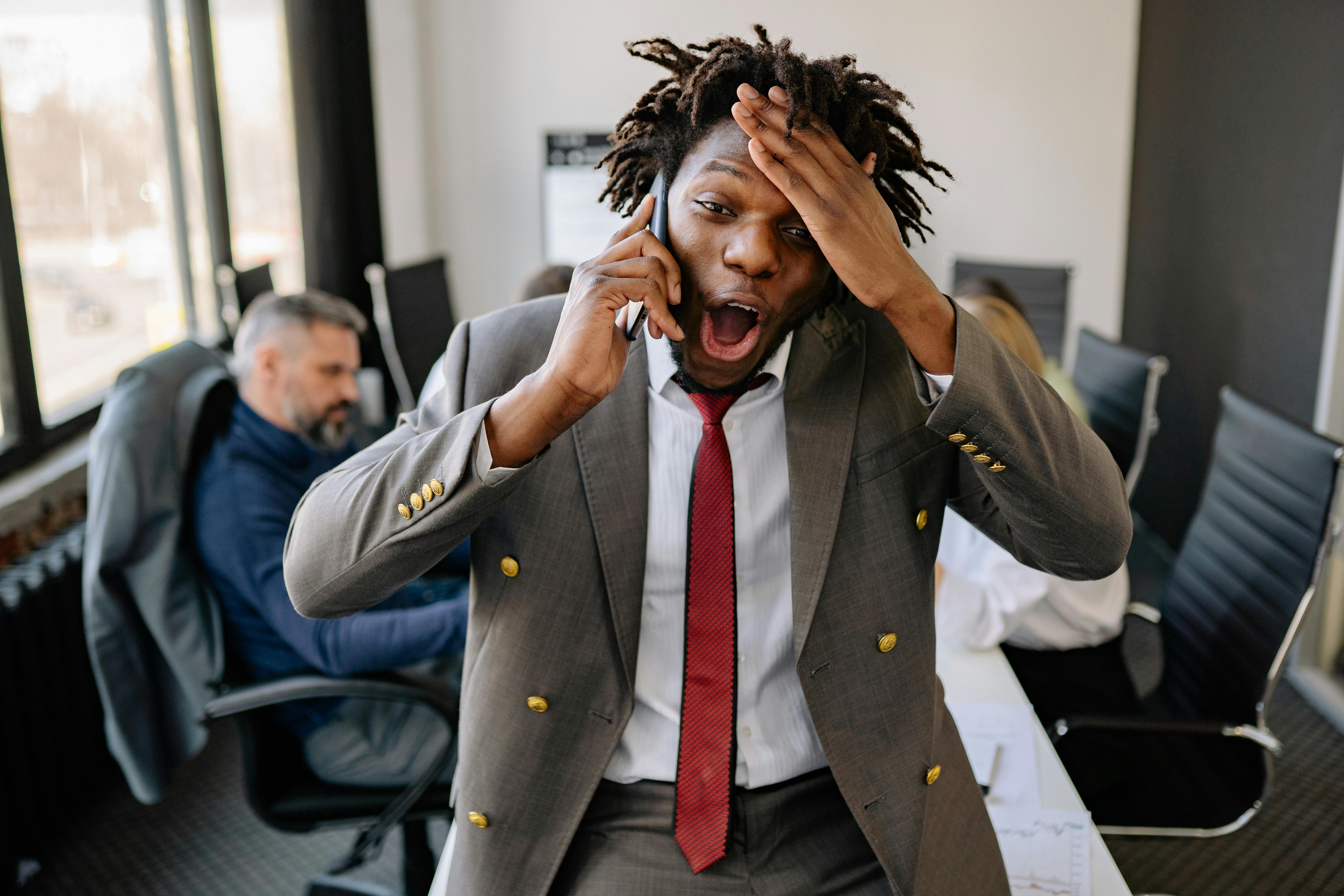 Photo of a Stressed Man with His Hand on His Head · Free Stock Photo