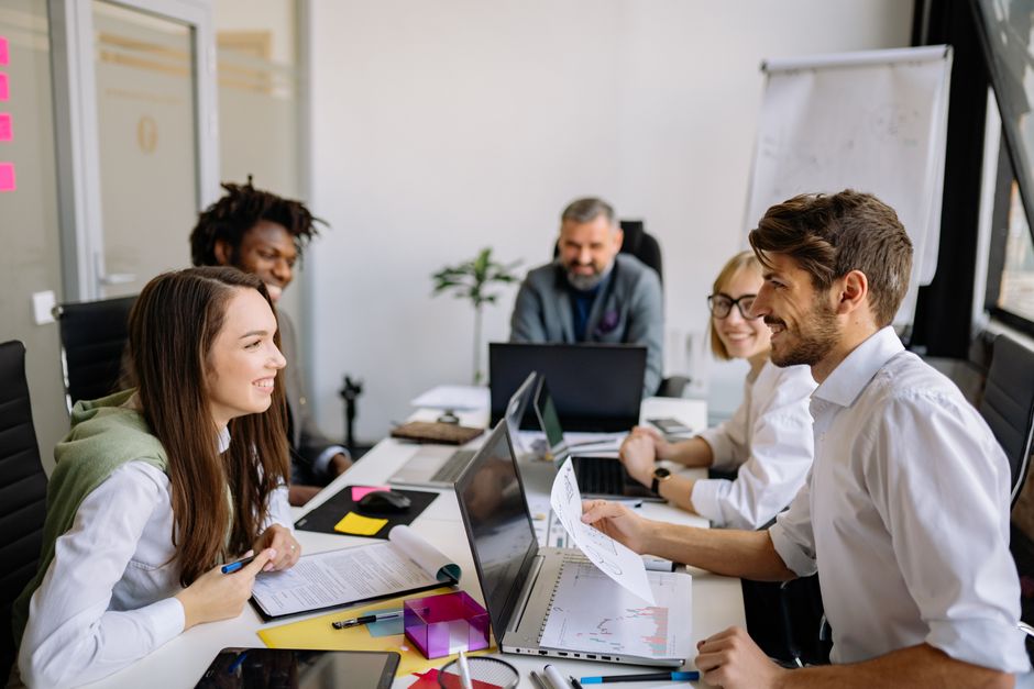 Photo by Yan Krukau on Pexels A diverse group of professionals engaging in a collaborative meeting in a modern office environment.