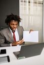 Man in Black Suit Jacket Holding White Paper