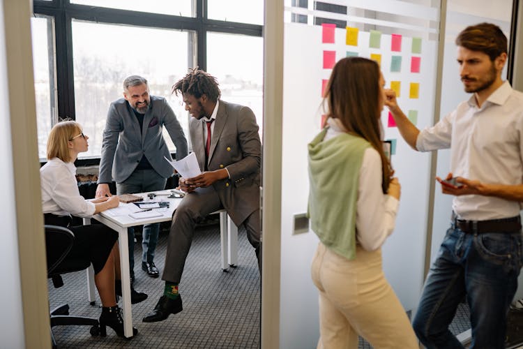 Group Of People Discussing About Work 