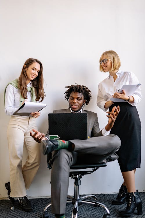 A Businessman Collaborating with His Employees