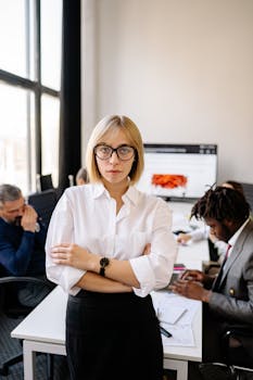 Professional businesswoman in an office leading a diverse team meeting.