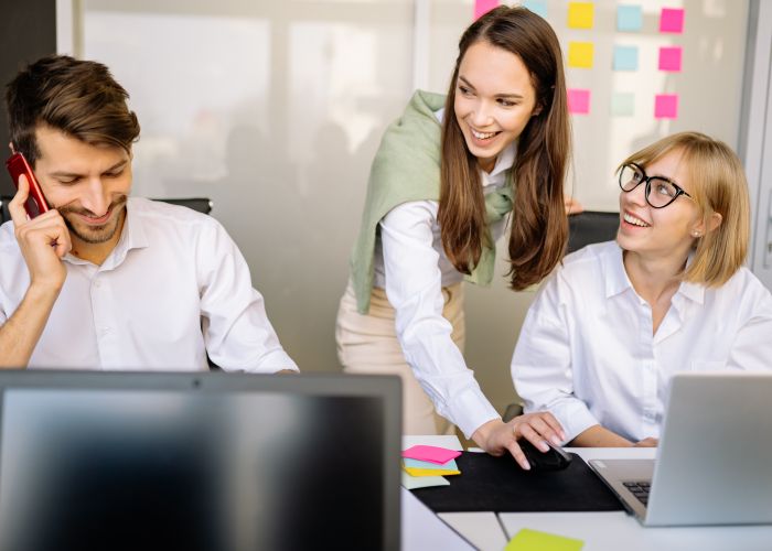Support team working together in an office