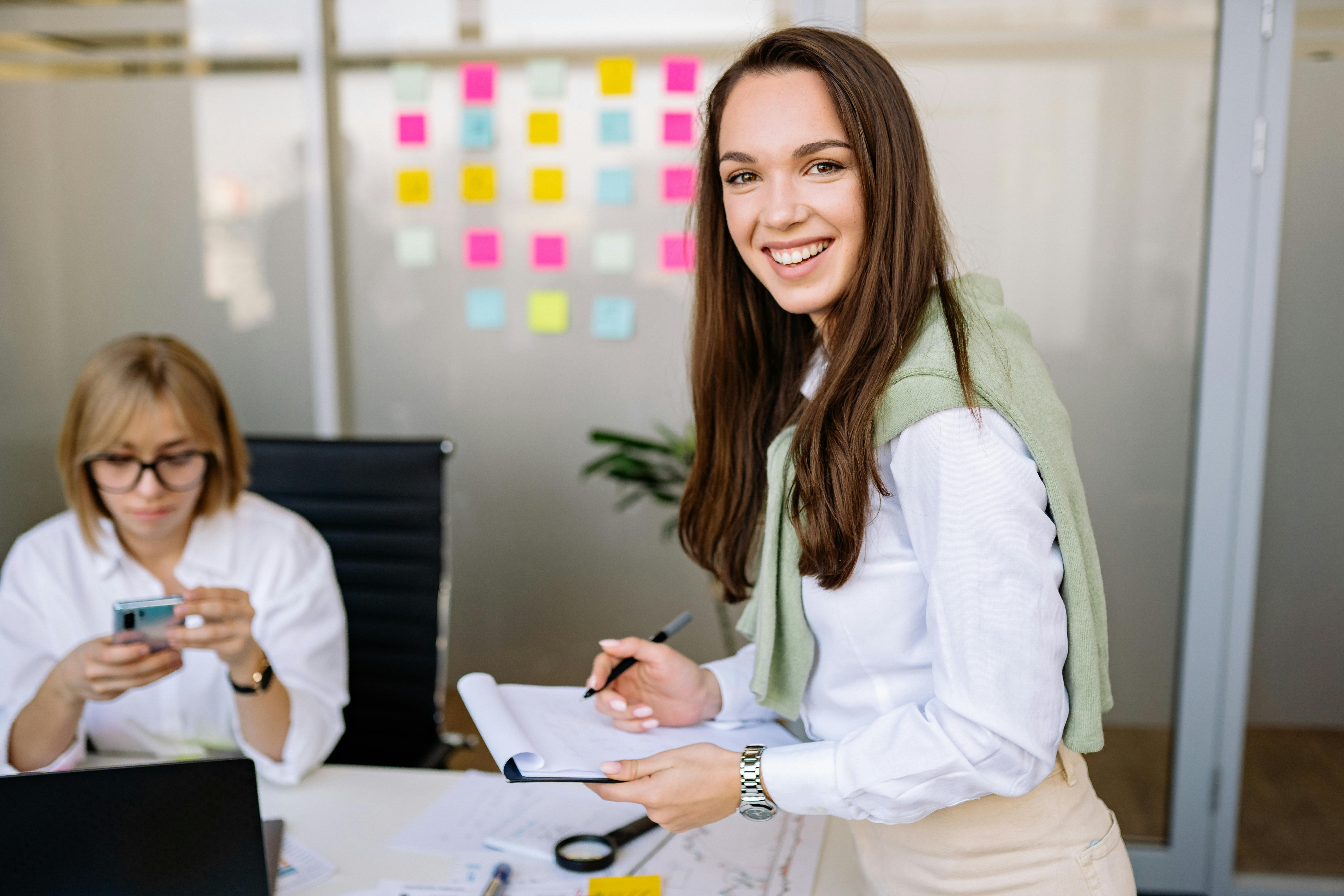 woman holding clipboard smiling