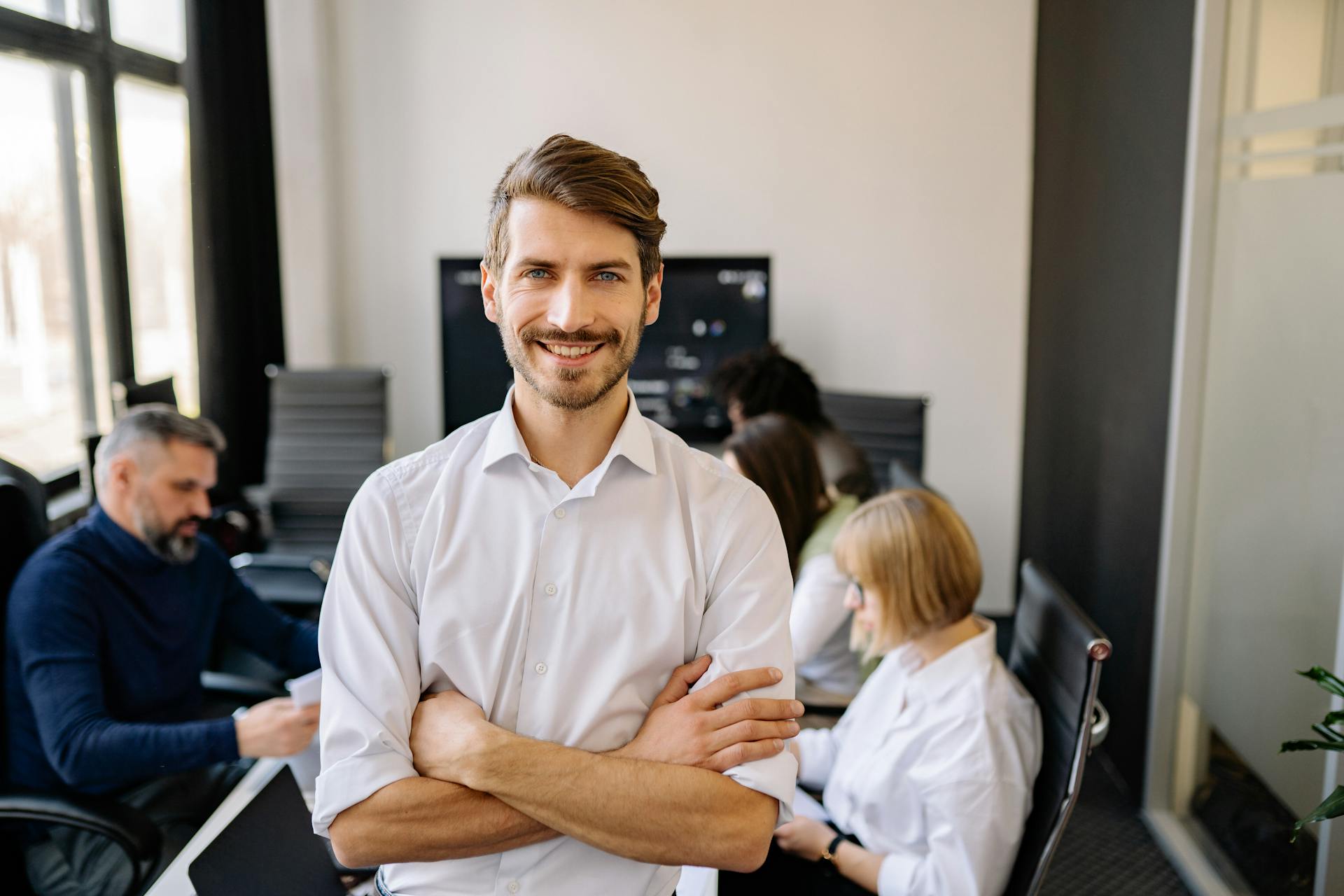 Man in White Long Sleeve Shirt Smiling