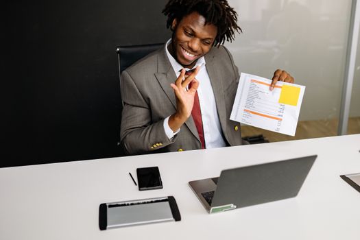 Man in Black Suit Jacket Holding Smartphone
