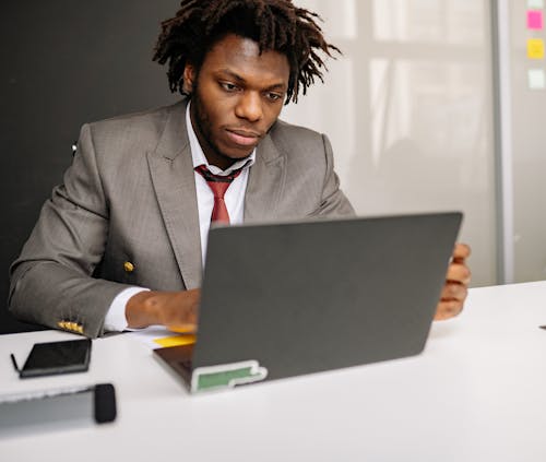 Free Man in Front of a Laptop Stock Photo