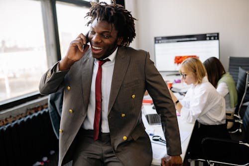 A Businessman Happily Having a Phone Call