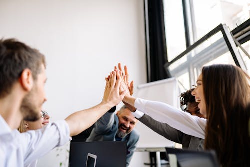 Office Team Huddling in the Room